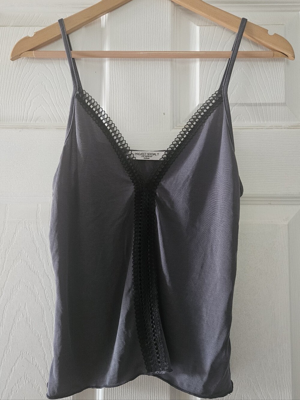 Project Social T cami features delicate black lace trim along the V-neckline M